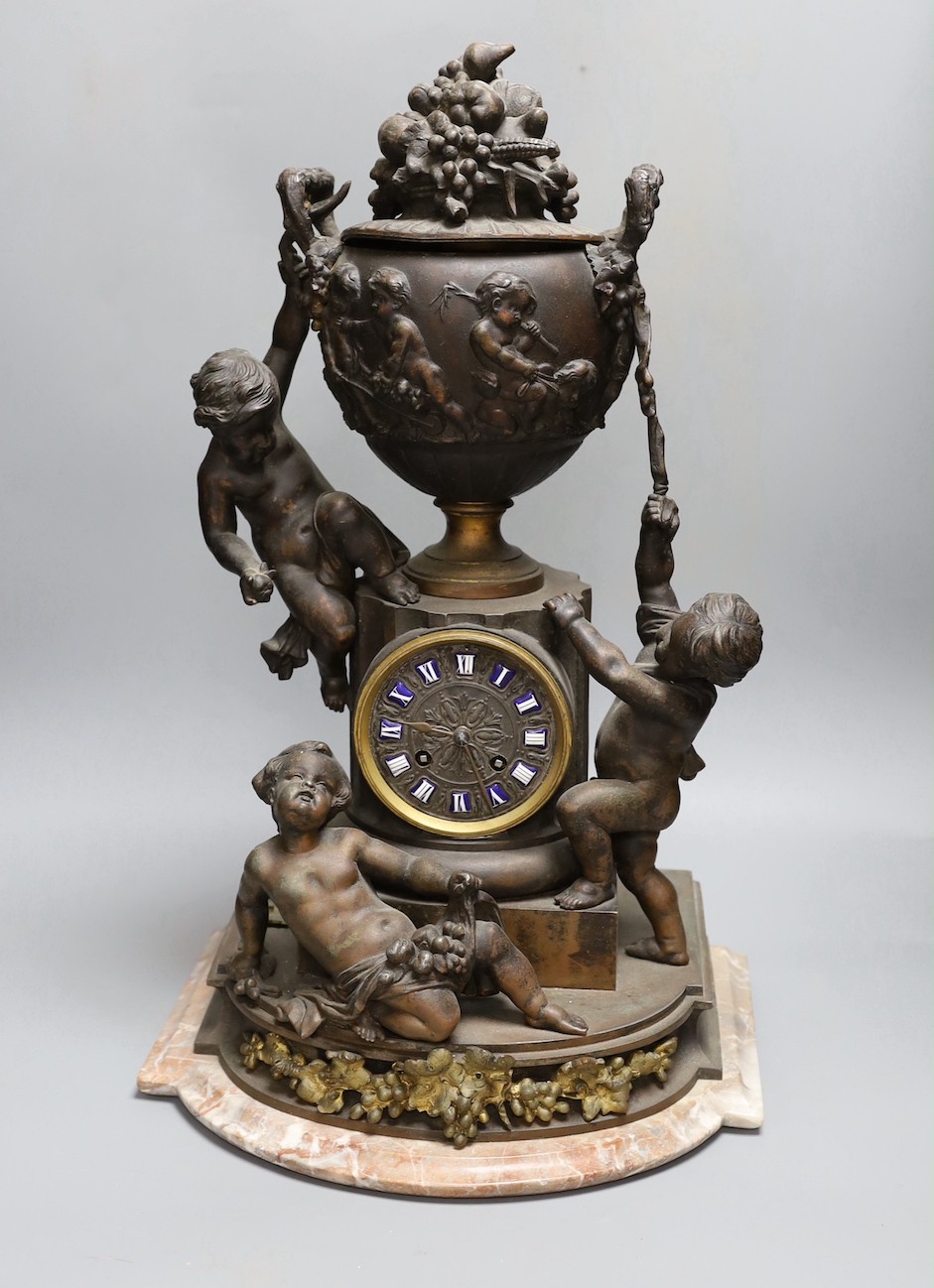 An early 20th century French bronzed spelter cherubic mantel clock 52cm